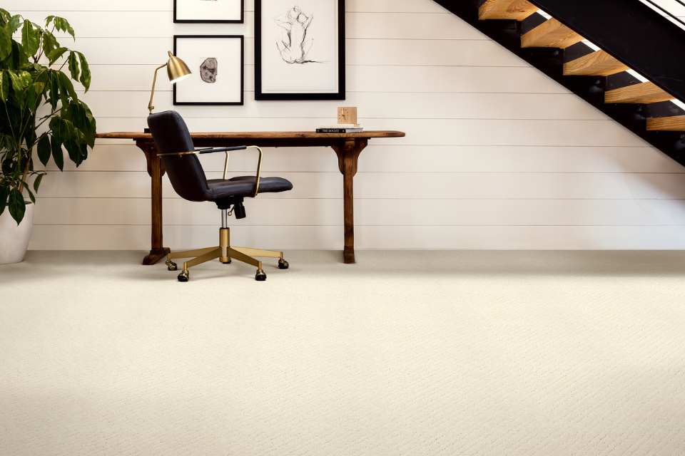 white patterned cut and loop pile carpet in office under the stairs